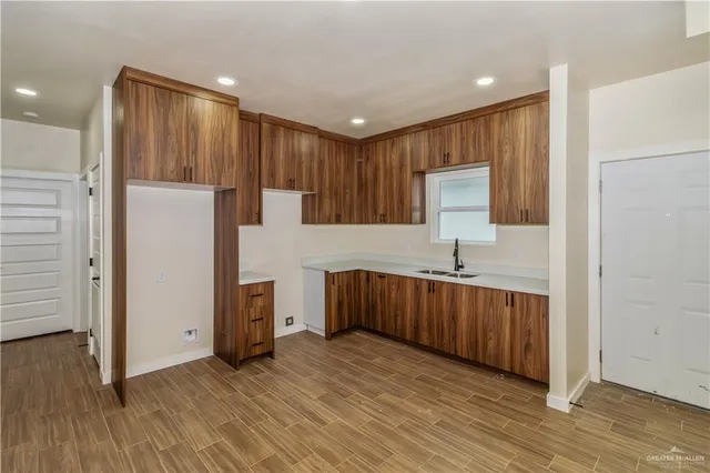 a bathroom with a sink toilet vanity and shower