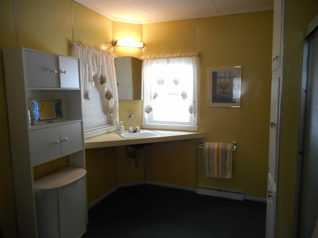 579 Riverside Drive Auburn, ME 04210 - Photo 17 of 23 This large bathroom is off the...