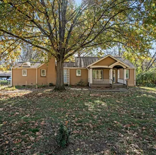 a house with trees in front of it