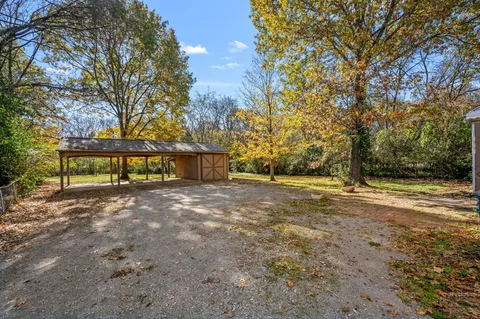 a view of a street with houses on both side