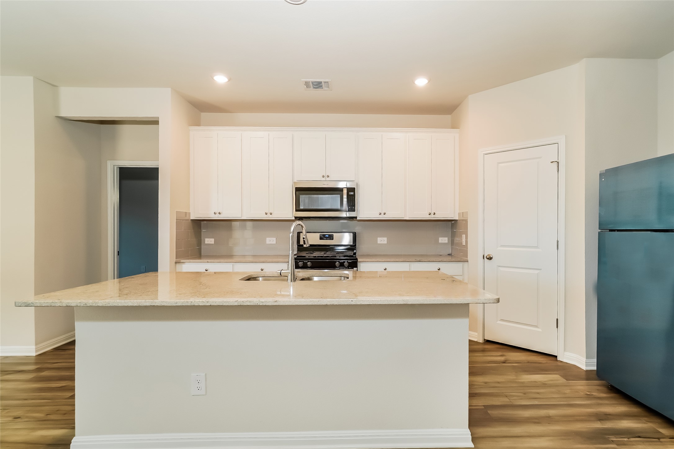 200 Babblebrook Way Hutto, TX 78634 - Photo 7 of 16 a view of a kitchen with a sink