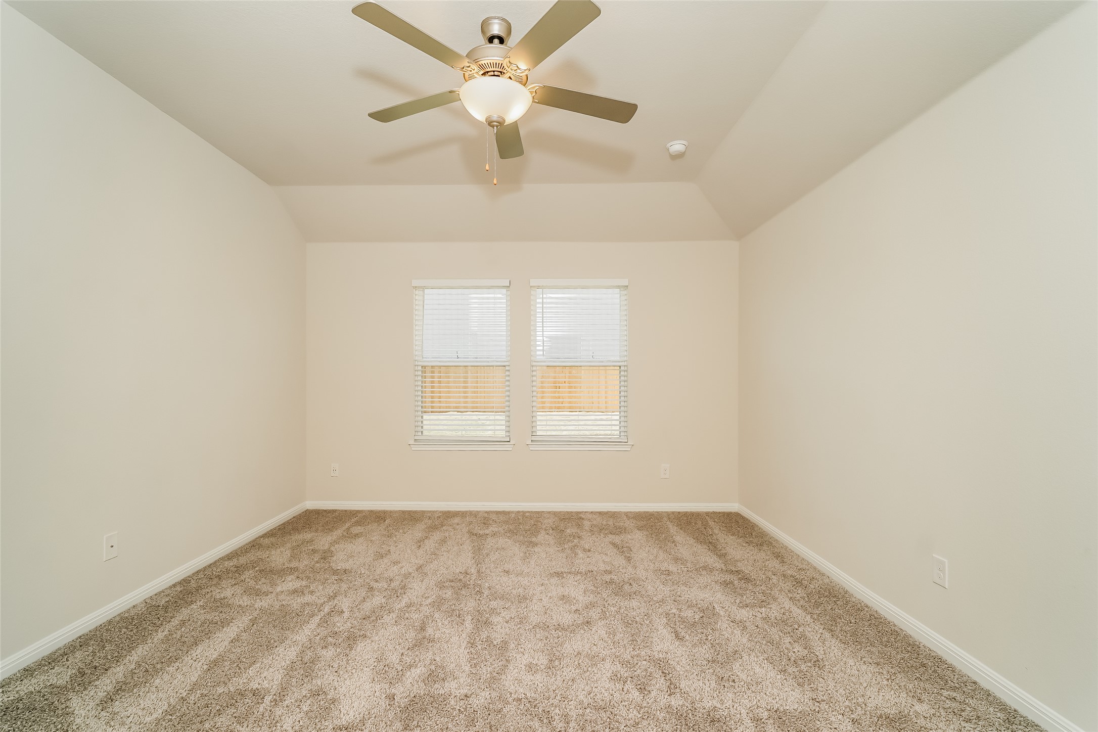 200 Babblebrook Way Hutto, TX 78634 - Photo 9 of 16 an empty room with a window and a fan
