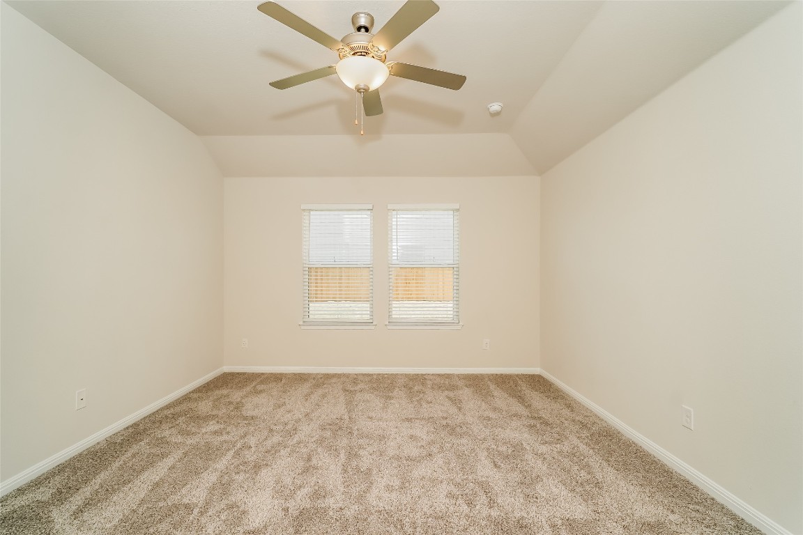 200 Babblebrook Way Hutto, TX 78634 - Photo 9 of 16 an empty room with a window and a fan