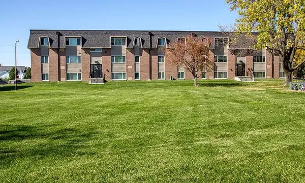 front view of a building with a yard