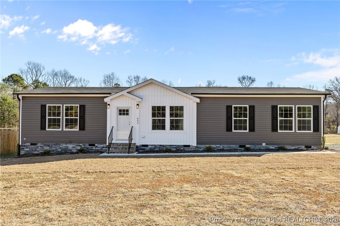849 Loop Road Bunnlevel, NC 28323 - Photo 1 of 39 a front view of a house