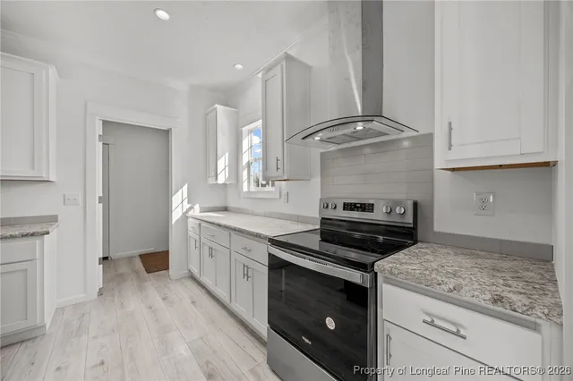 a kitchen with a stove and a sink
