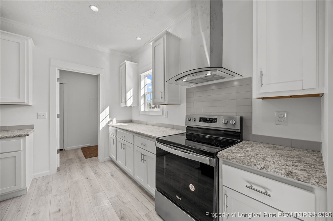 849 Loop Road Bunnlevel, NC 28323 - Photo 11 of 39 a kitchen with a stove and a sink