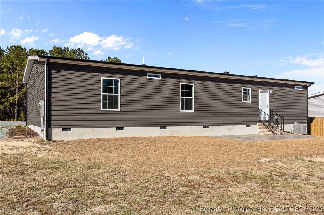 849 Loop Road Bunnlevel, NC 28323 - Photo 34 of 39 a front view of a house with a yard