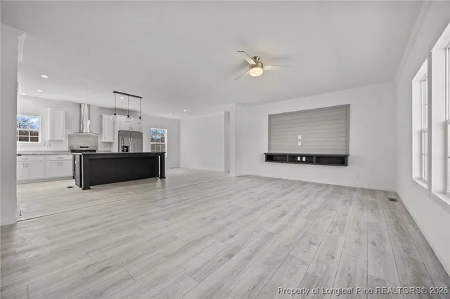 a view of a kitchen with microwave and cabinets