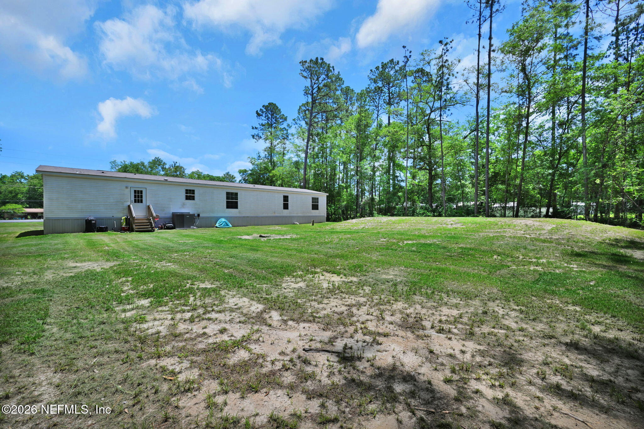 540783 Lem Turner Road Callahan, FL 32011 - Photo 34 of 36 a view of a house with a big yard
