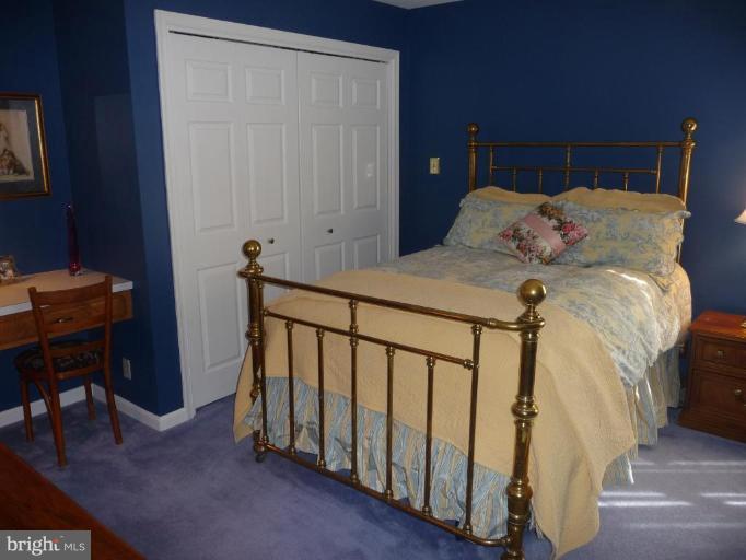 3165 Hickory Ridge Road Dunkirk, MD 20754 - Photo 11 of 30 a bedroom with a bed and a table in it