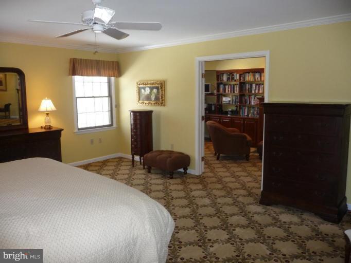 3165 Hickory Ridge Road Dunkirk, MD 20754 - Photo 18 of 30 a bedroom with a bed and a walk in closet