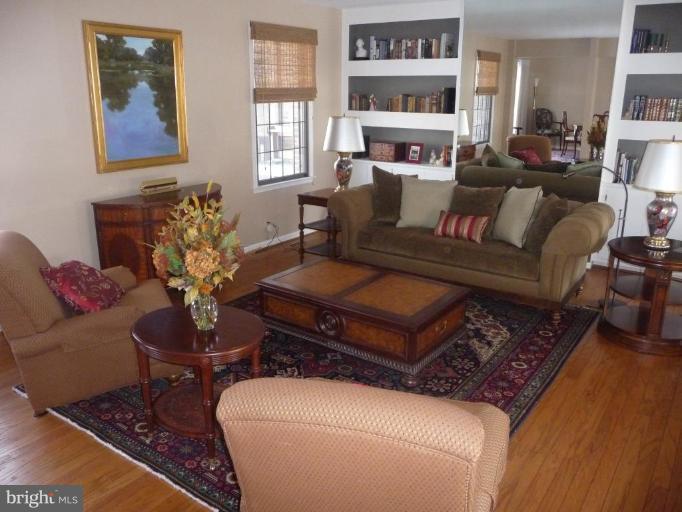 3165 Hickory Ridge Road Dunkirk, MD 20754 - Photo 7 of 30 a living room with furniture a couch and a bookshelf