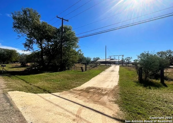 a view of a yard with cars