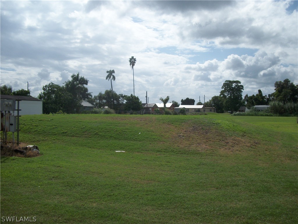 1002-1009 Nalls Road Clewiston, FL 33440 - Photo 14 of 19 a view of a golf course with a lake