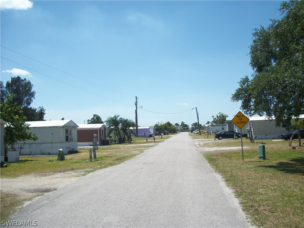 1002-1009 Nalls Road Clewiston, FL 33440 - Photo 3 of 19 a view of a street with houses