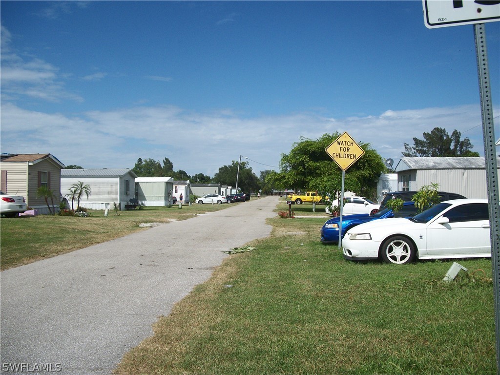 1002-1009 Nalls Road Clewiston, FL 33440 - Photo 8 of 19 a view of street with parked cars