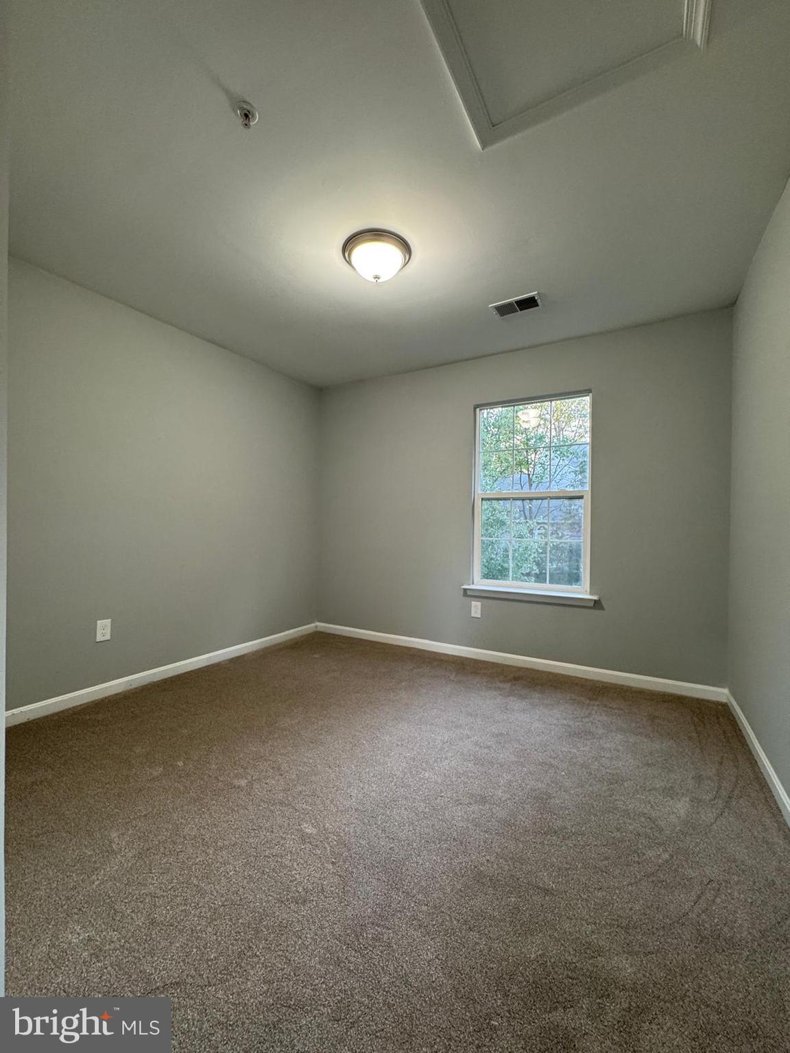 16107 Eckhart Road Bowie, MD 20716 - Photo 15 of 18 an empty room with a empty space and windows