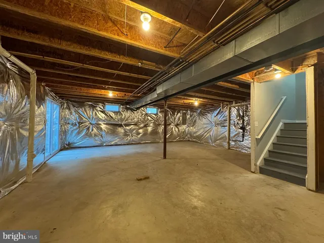 a view of an empty room with stairs