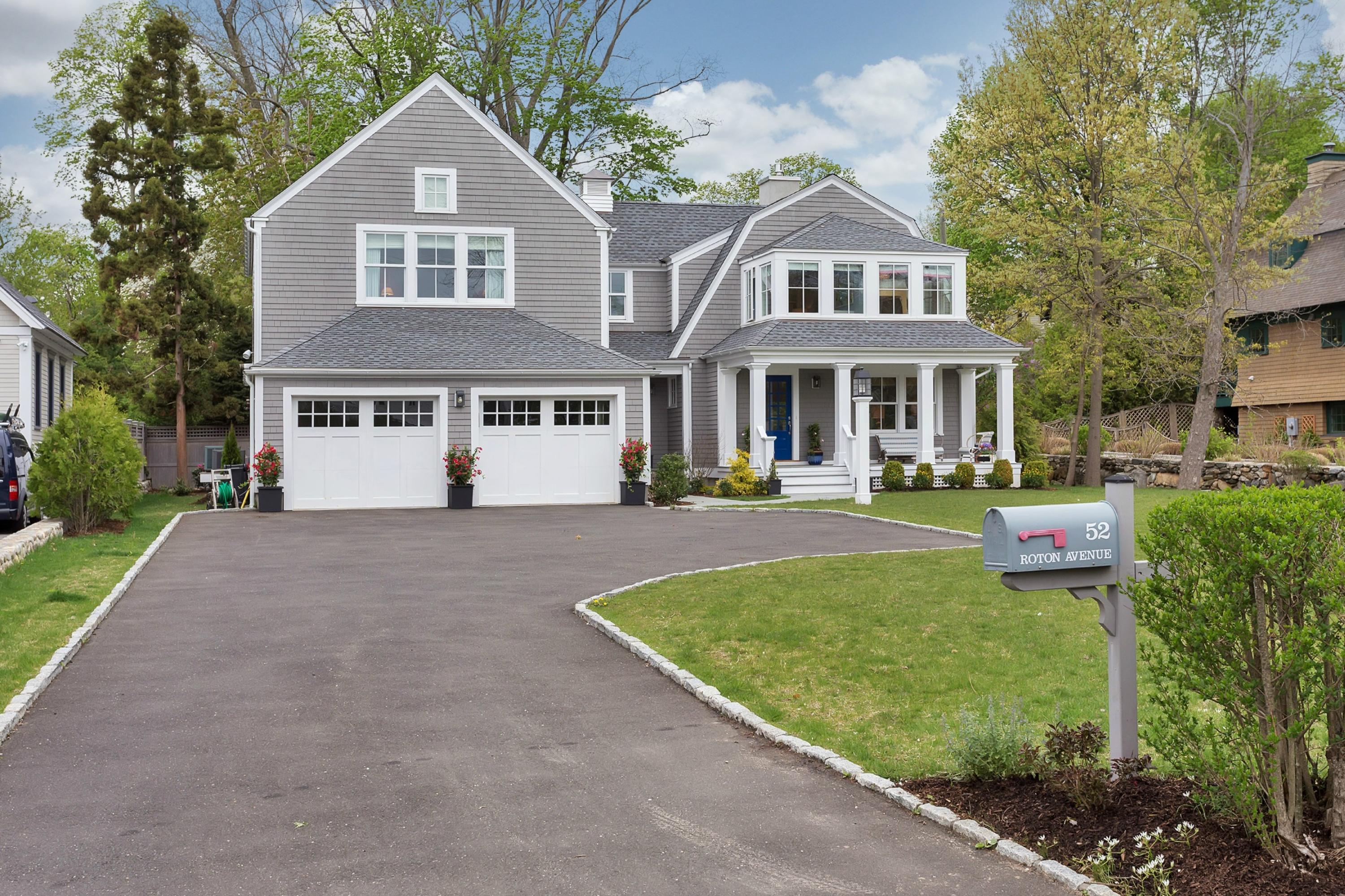 52 Roton Avenue Rowayton, CT 06853 - Photo 1 of 20 a front view of a house with a yard