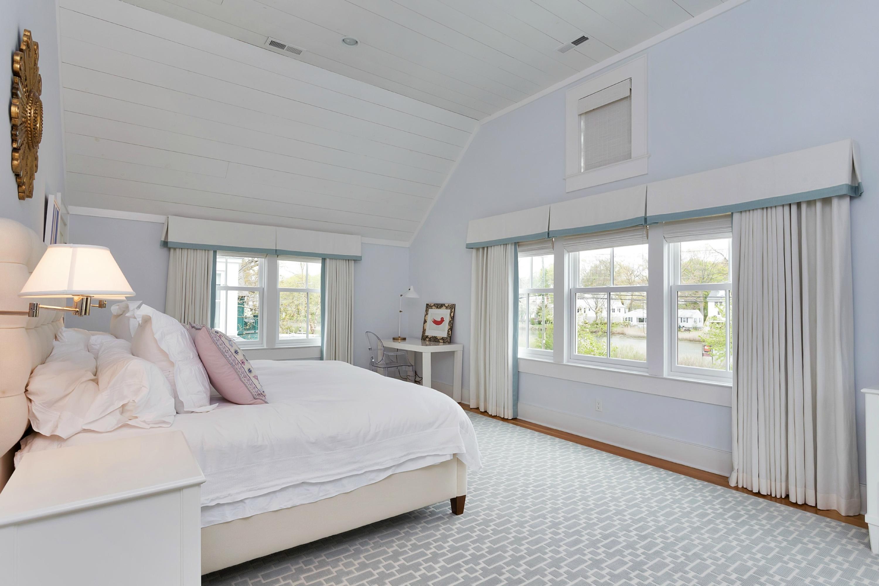 52 Roton Avenue Rowayton, CT 06853 - Photo 12 of 20 a bedroom with a large bed and a large window