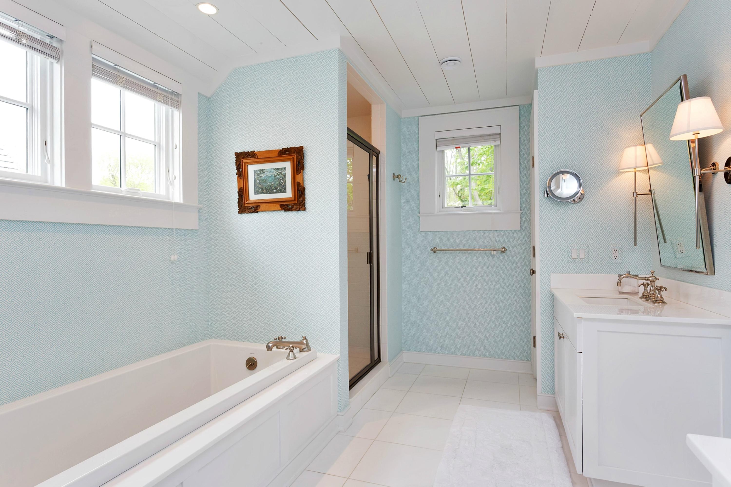 52 Roton Avenue Rowayton, CT 06853 - Photo 16 of 20 a bathroom with a tub sink and mirror