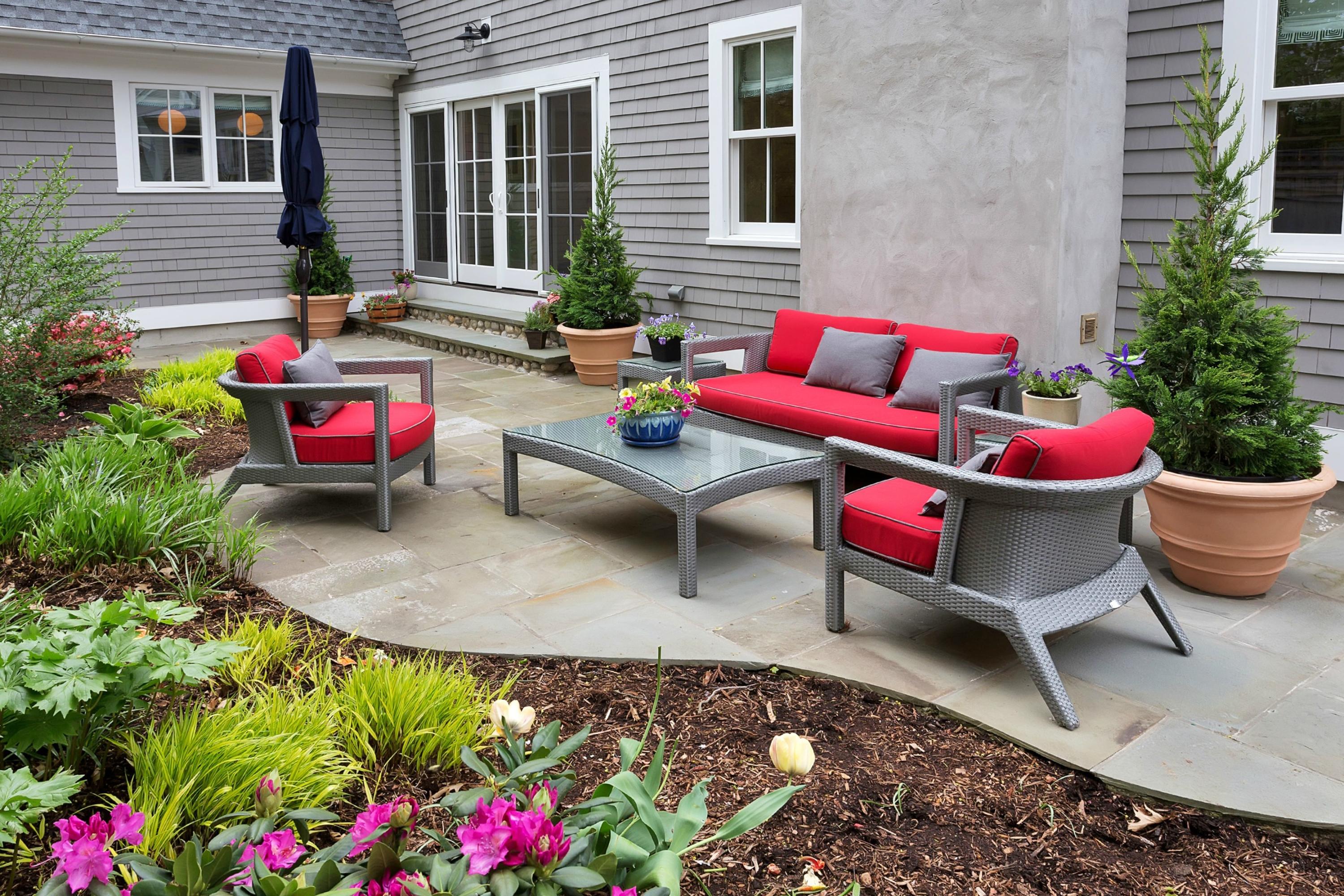 52 Roton Avenue Rowayton, CT 06853 - Photo 19 of 20 a building outdoor space with patio furniture and flowers