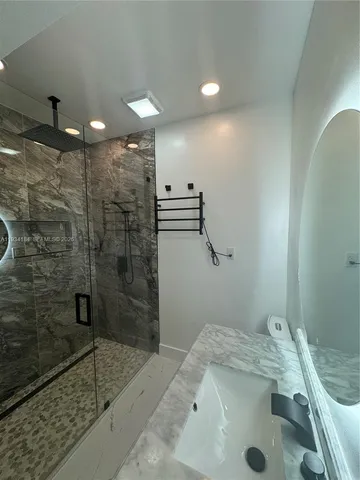 a front view of house with yard and trees in the background