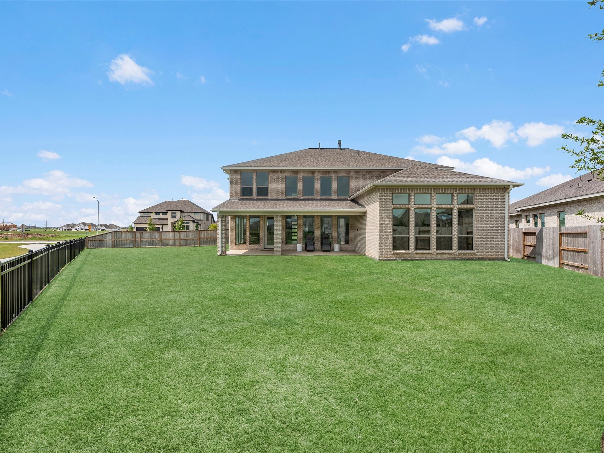 18714 Pistachio Way Manvel, TX 77578 - Photo 41 of 48 Set on an oversized corner homesite of more than 14,000 square feet, the expansive backyard and side yard provide endless possibilities for a future pool, play area, garden, trampoline, or outdoor entertaining, all just steps from the neighborhood walking trails.