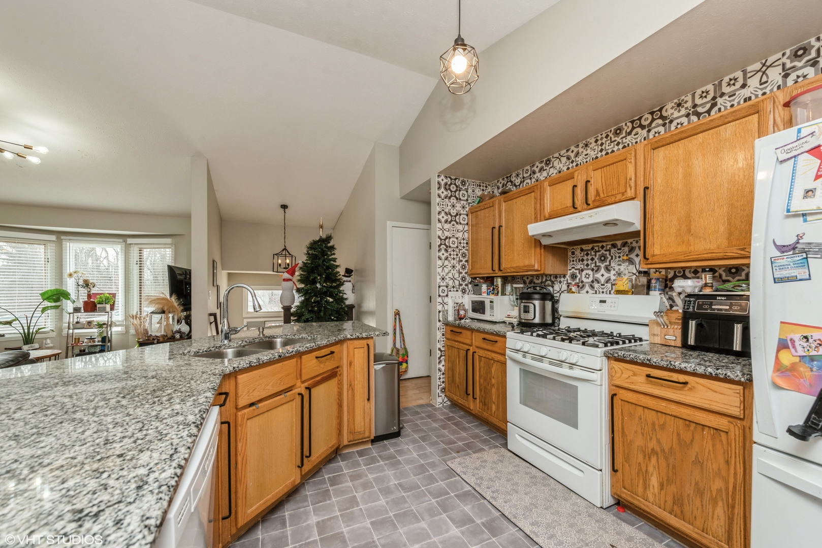 412 Lamplighter Loop Southeast Poplar Grove, IL 61065 - Photo 7 of 23 a kitchen with white cabinets and appliances