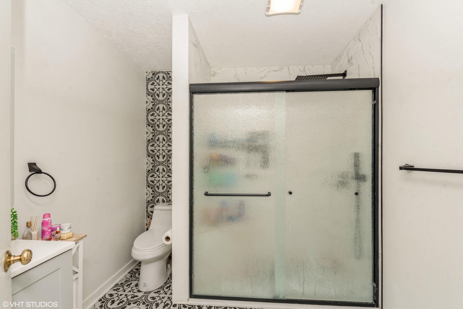 412 Lamplighter Loop Southeast Poplar Grove, IL 61065 - Photo 9 of 23 a bathroom with a toilet a sink and a shower