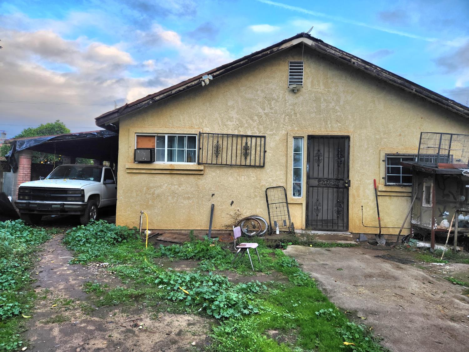 3793 Cottle Avenue Sanger, CA 93657 - Photo 2 of 4 a front view of a house with garden