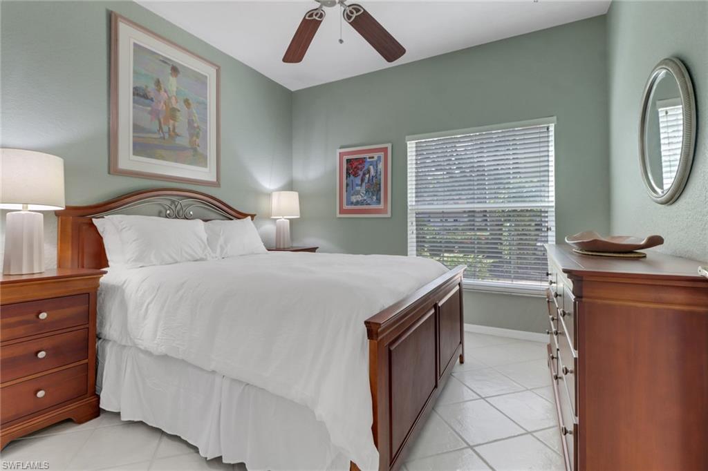 5325 Andover Drive, Unit 101 Naples, FL 34110 - Photo 14 of 25 Tiled bedroom with ceiling fan
