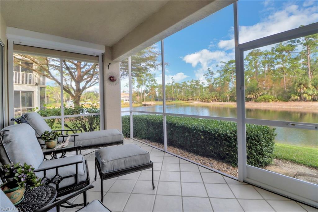 5325 Andover Drive, Unit 101 Naples, FL 34110 - Photo 22 of 25 Sunroom featuring a water view