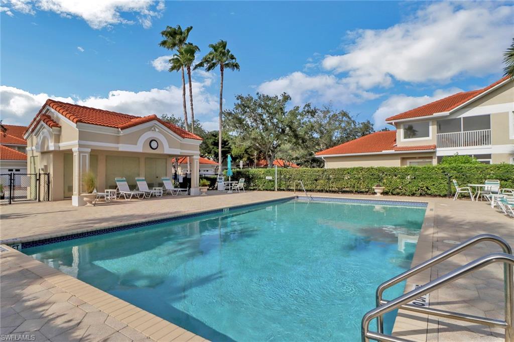 5325 Andover Drive, Unit 101 Naples, FL 34110 - Photo 25 of 25 View of swimming pool with a patio area
