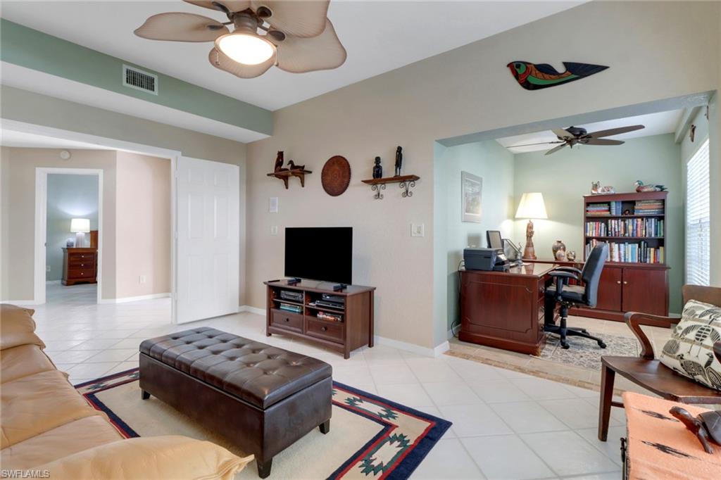5325 Andover Drive, Unit 101 Naples, FL 34110 - Photo 5 of 25 Living room with light tile patterned floors