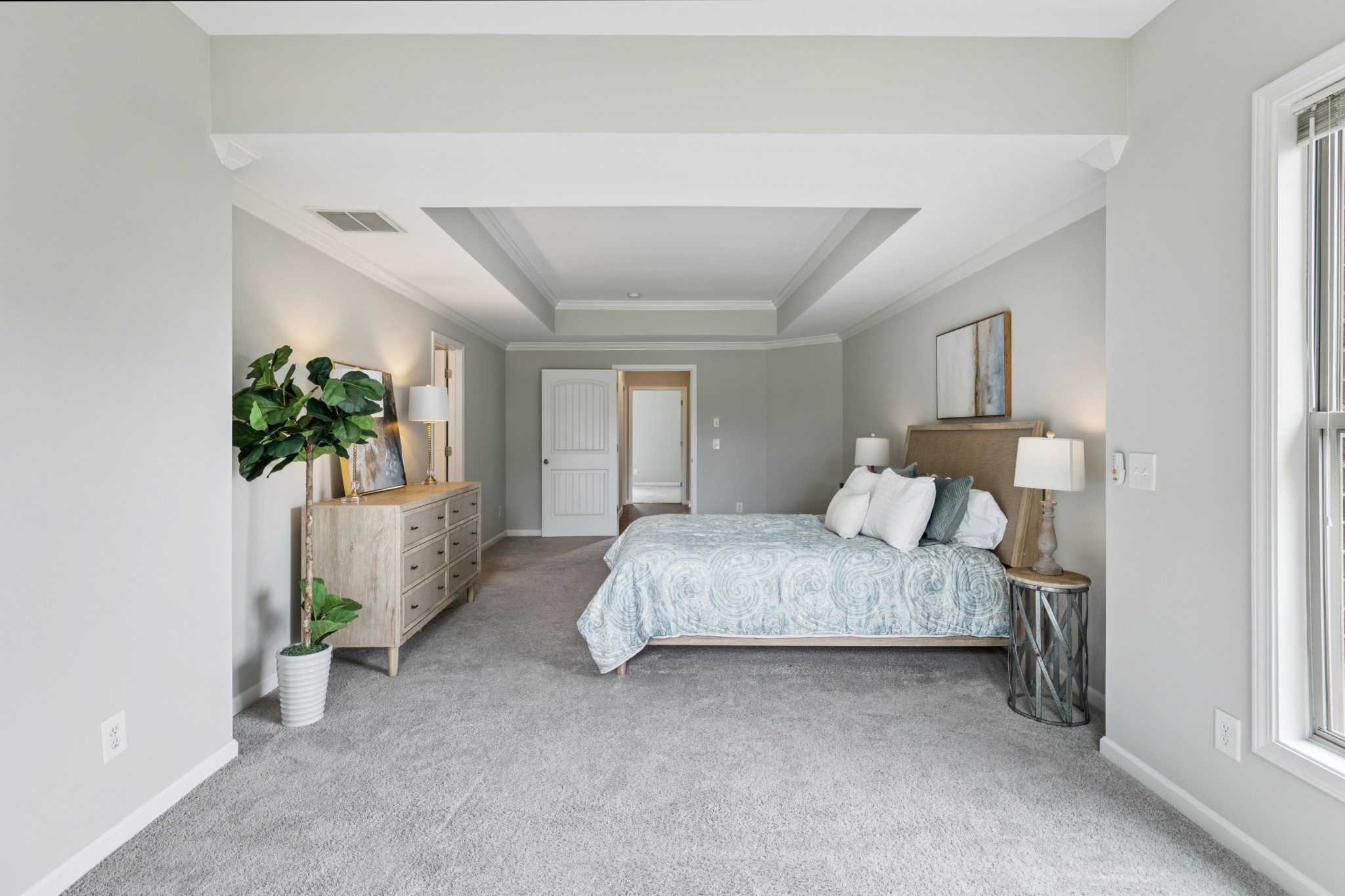 2040 Belshire Way Spring Hill, TN 37174 - Photo 30 of 74 a spacious bedroom with a bed and a potted plant