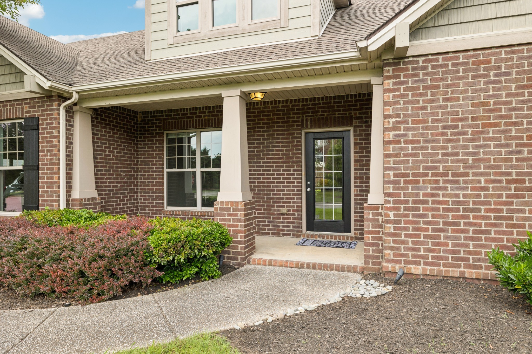 2040 Belshire Way Spring Hill, TN 37174 - Photo 3 of 74 a front view of a brick house with a large window