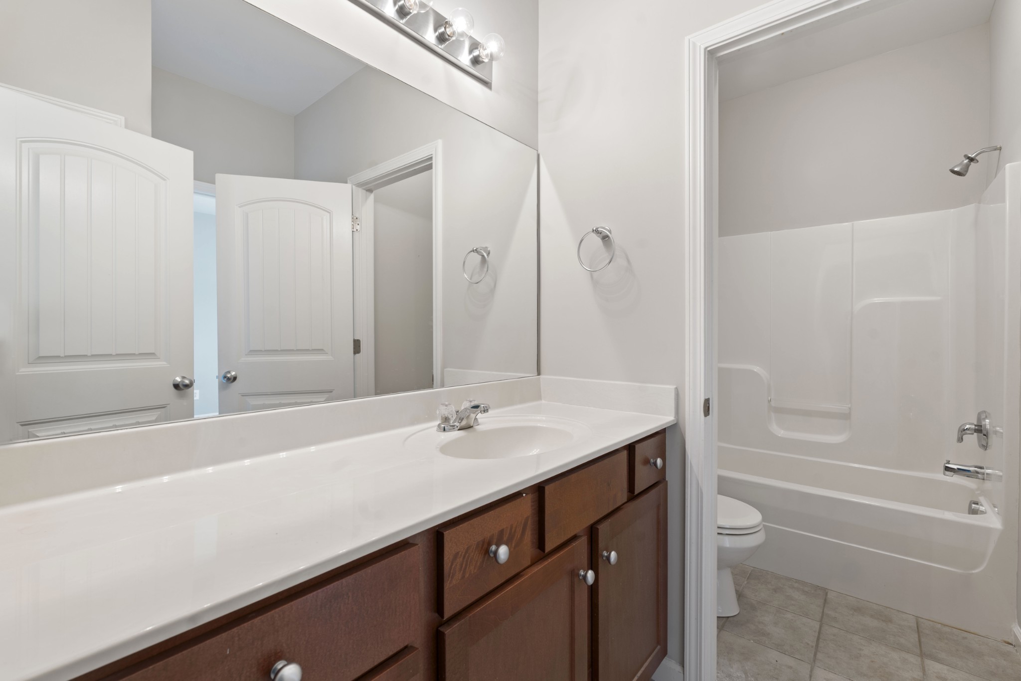 2040 Belshire Way Spring Hill, TN 37174 - Photo 54 of 74 a bathroom with a sink a toilet and shower