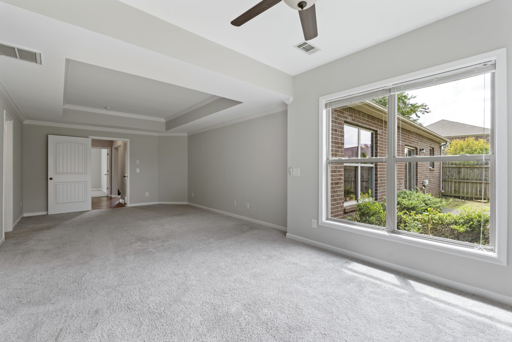 2040 Belshire Way Spring Hill, TN 37174 - Photo 57 of 74 a view of a big room with windows and chandelier fan