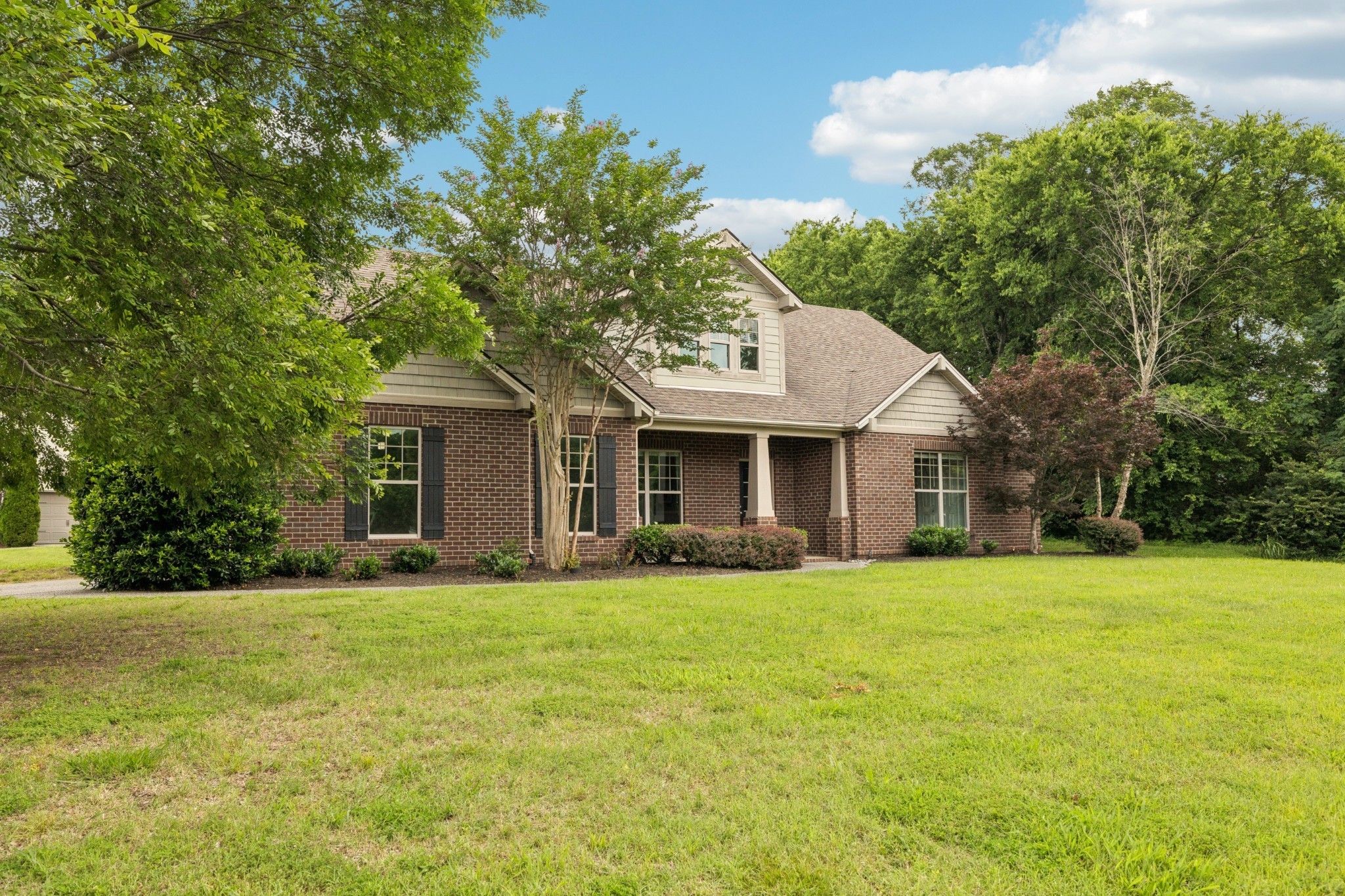 2040 Belshire Way Spring Hill, TN 37174 - Photo 6 of 74 a front view of a house with a yard