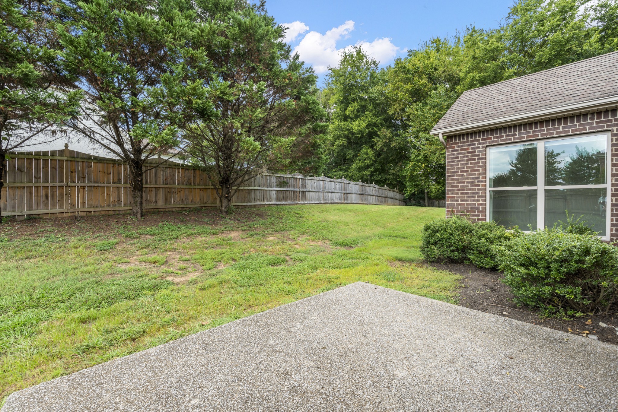 2040 Belshire Way Spring Hill, TN 37174 - Photo 63 of 74 a view of a backyard with a small cabin