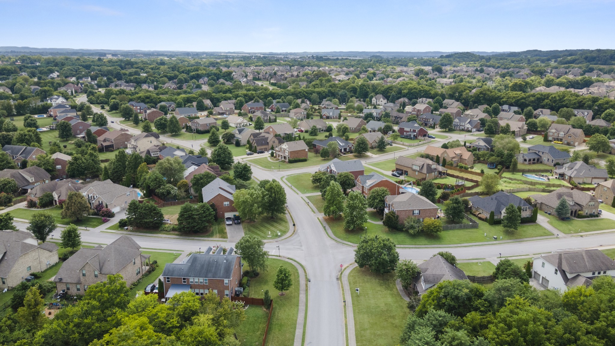 2040 Belshire Way Spring Hill, TN 37174 - Photo 68 of 74 an aerial view of residential houses with outdoor space and trees