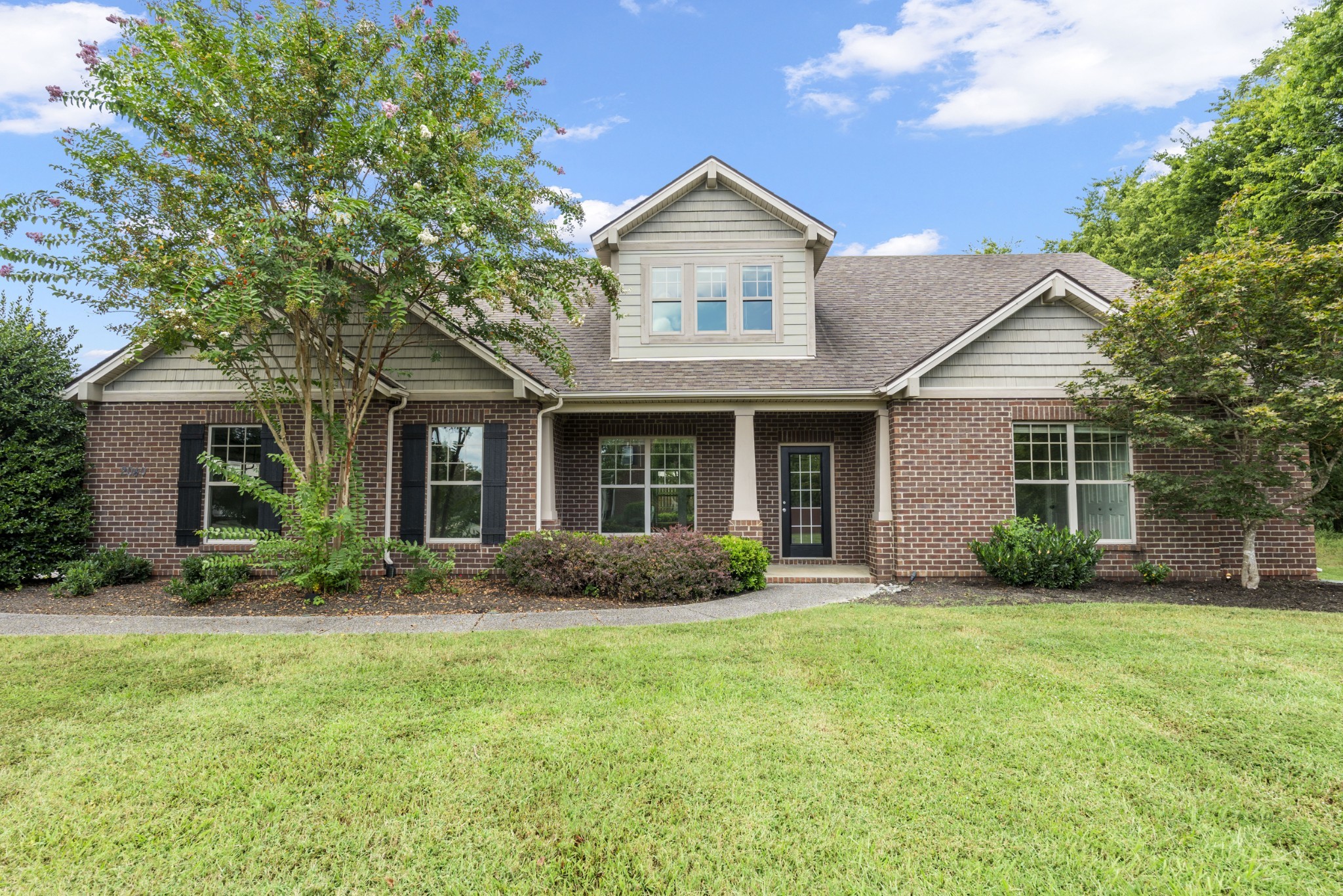 2040 Belshire Way Spring Hill, TN 37174 - Photo 70 of 74 front view of a brick house with a yard