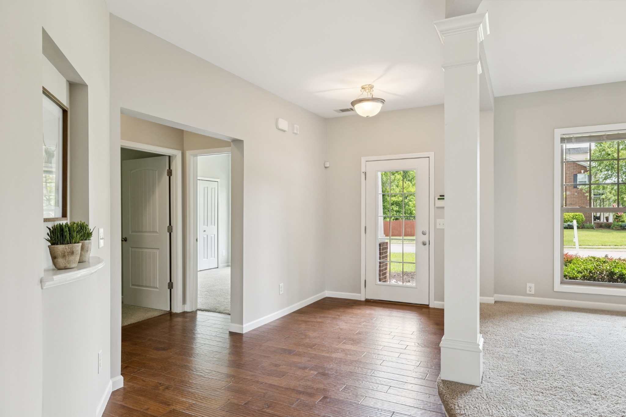 2040 Belshire Way Spring Hill, TN 37174 - Photo 10 of 74 an empty room with wooden floor and windows