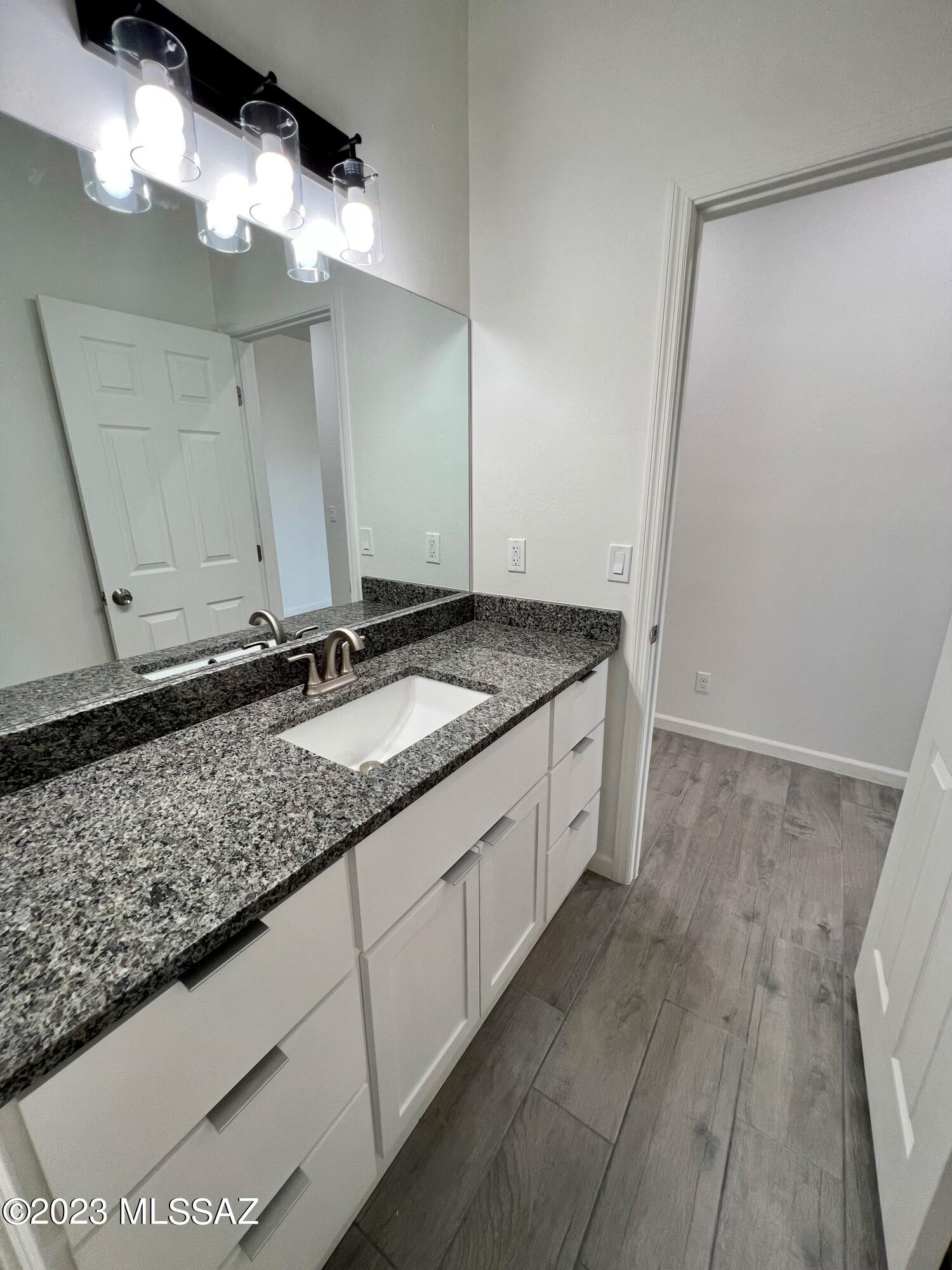 353 Dock Street Rio Rico, AZ 85648 - Photo 37 of 50 a bathroom with a sink and a mirror