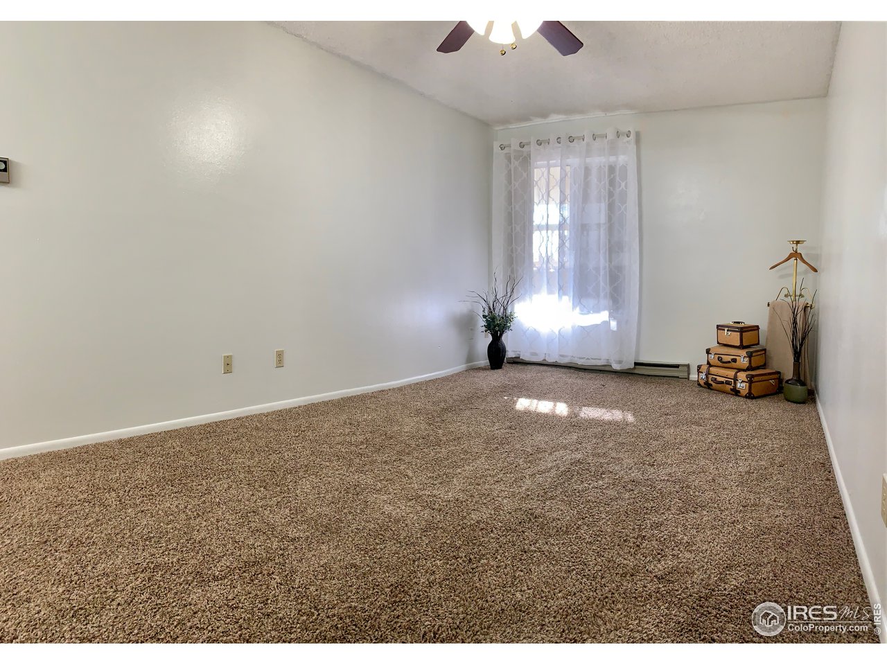 1672 Riverside Avenue, Unit 116 Fort Collins, CO 80525 - Photo 16 of 39 a view of empty room with window
