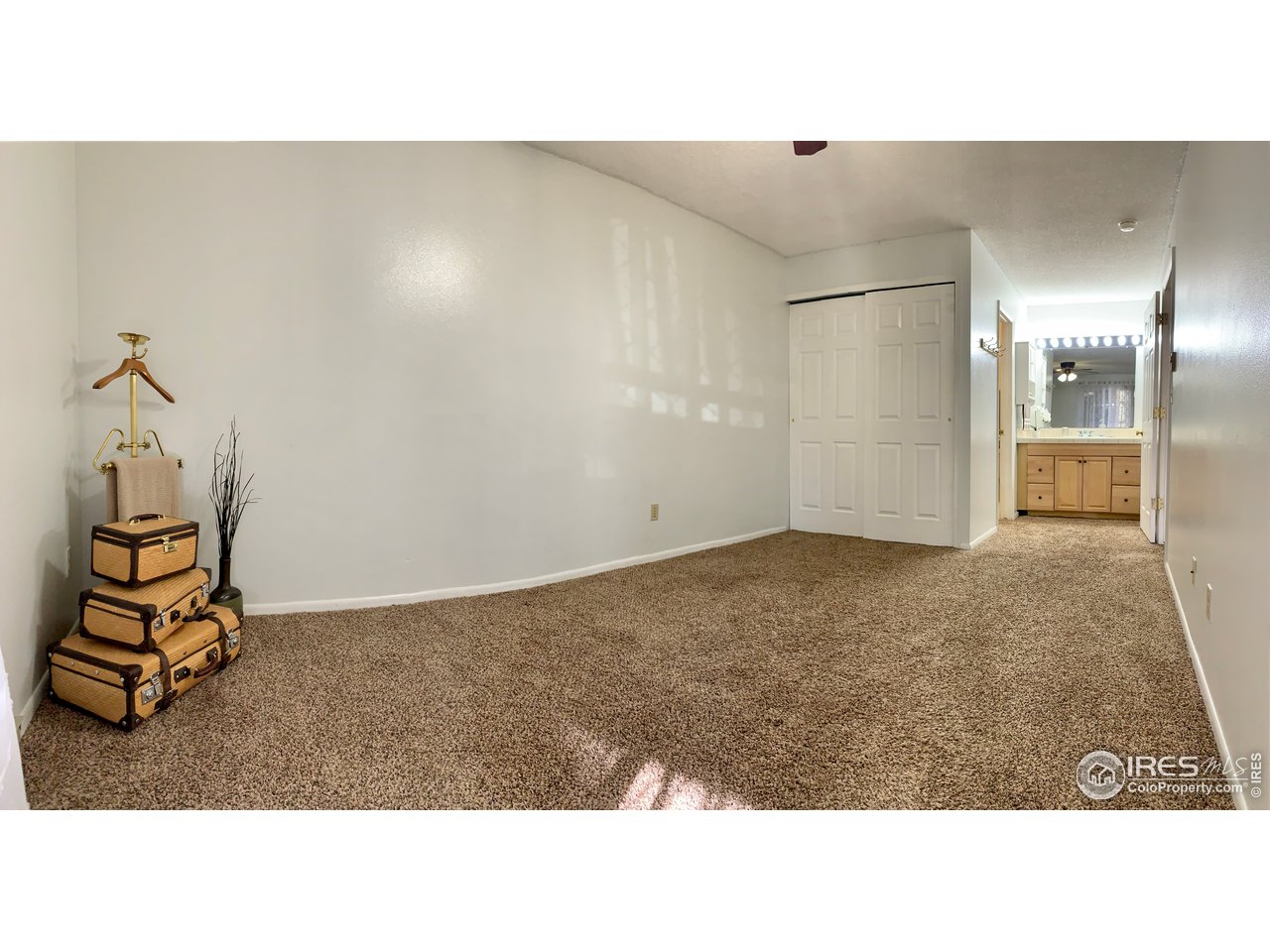1672 Riverside Avenue, Unit 116 Fort Collins, CO 80525 - Photo 23 of 39 a open hall with a bench