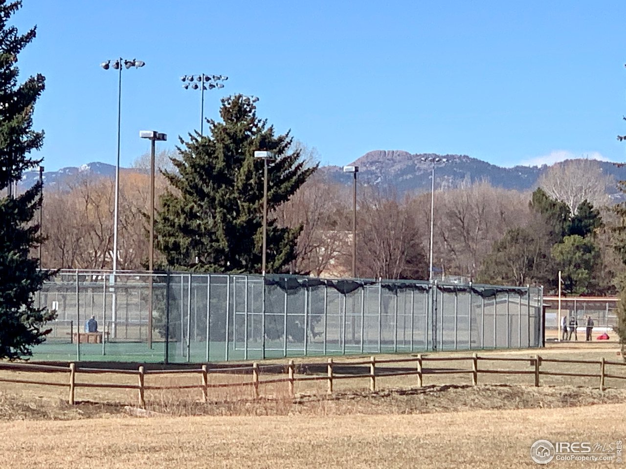 1672 Riverside Avenue, Unit 116 Fort Collins, CO 80525 - Photo 35 of 39 a view of a yard and a fence