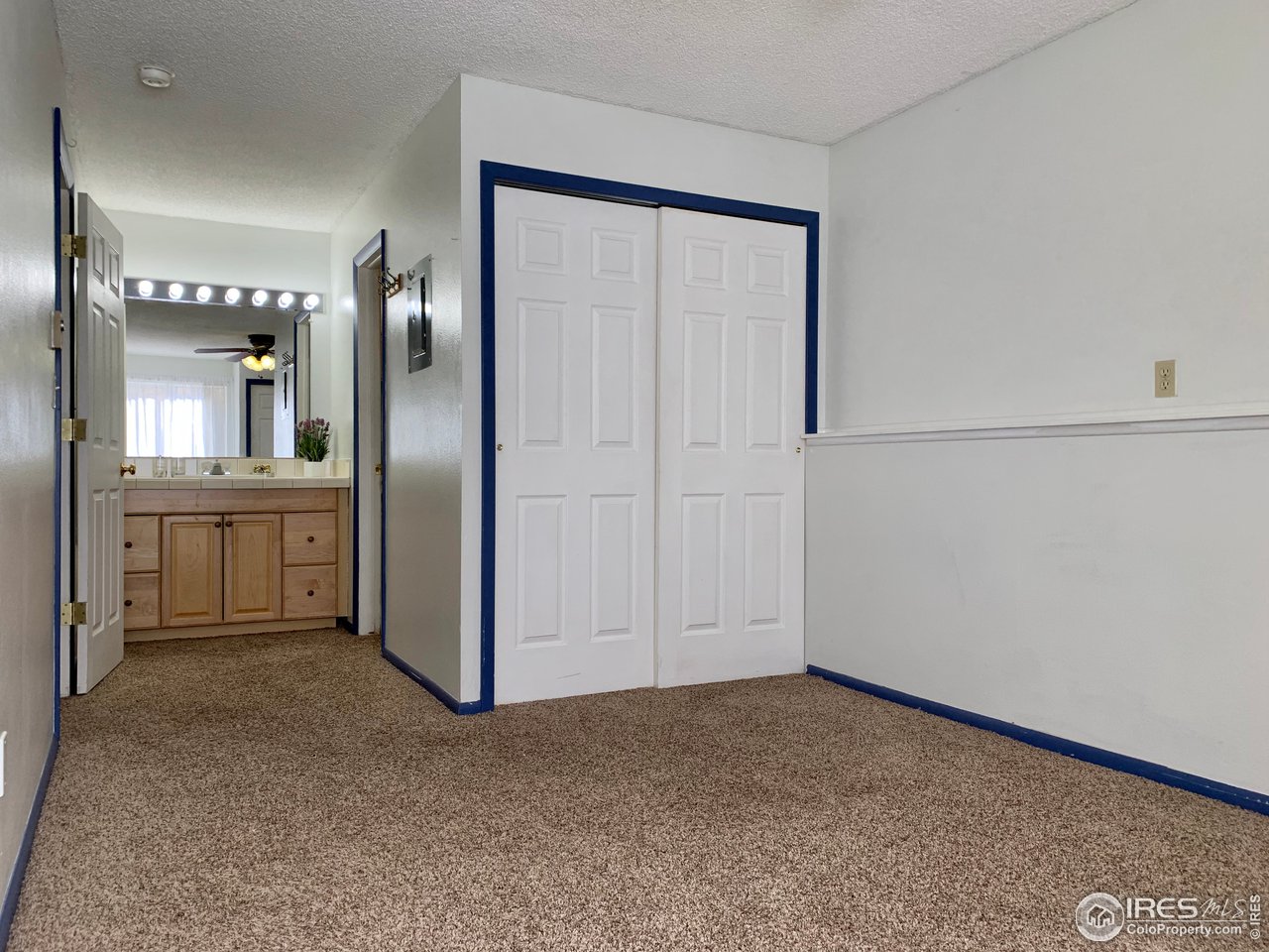 1672 Riverside Avenue, Unit 116 Fort Collins, CO 80525 - Photo 9 of 39 an empty room with windows and entrance